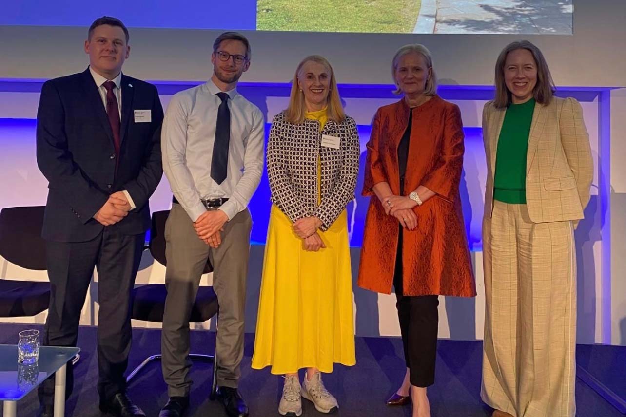 Academics and CEO posing for a photograph at an event