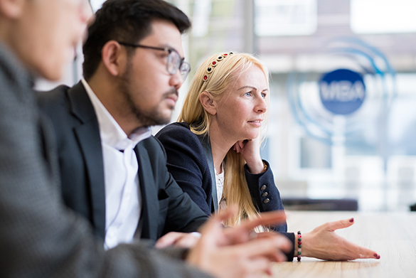 MBA candidates sat around a table