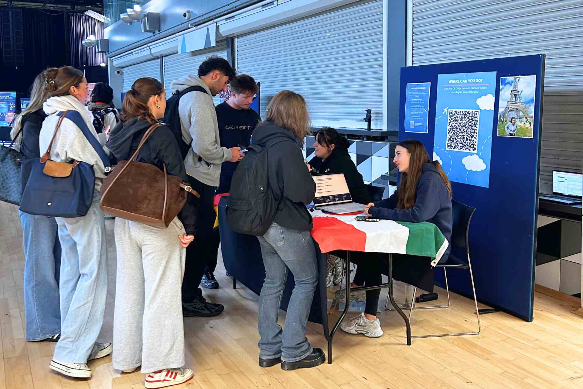 A group of students talking to the Global Opportunities team at the University of Liverpool Global Opportunities fair 2025