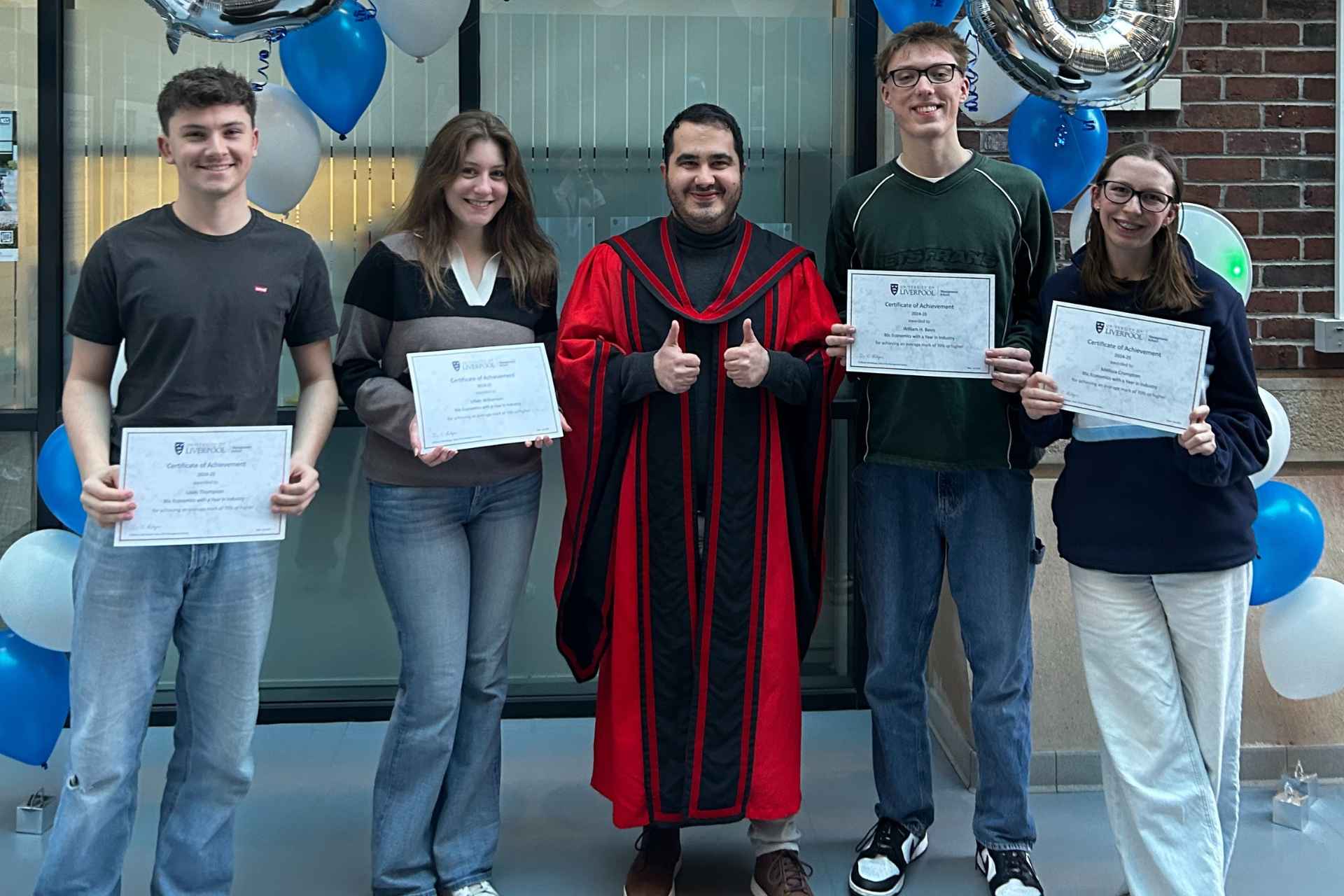 A group picture of BSc Economic students and Director of Studies at the undergraduate achievement celebration event