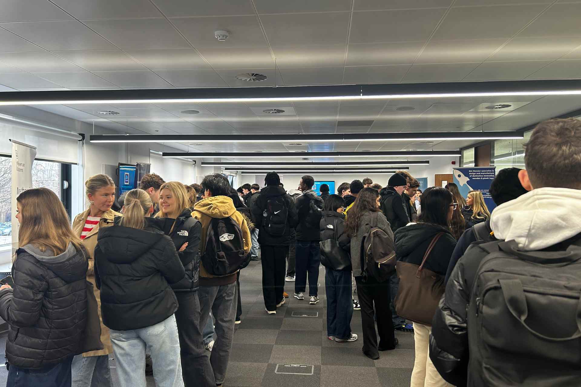 A picture of students networking with companies at the undergraduate careers fair