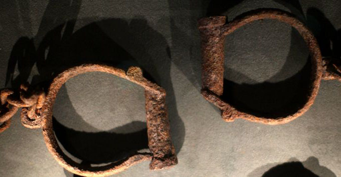 Photograph of two old manacles