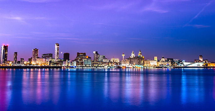 Photograph from the water of the Liverpool skyline at night