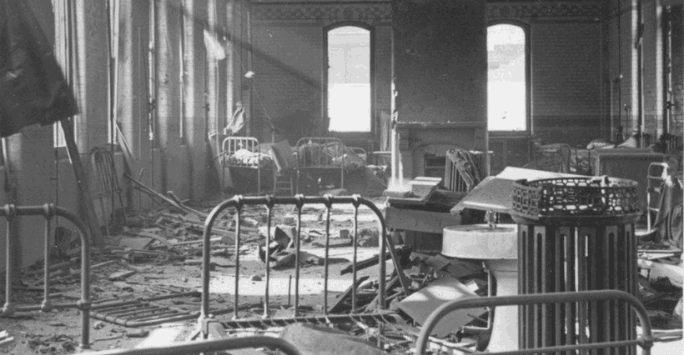 black and white photo of ward damaged after a bombing in world war two