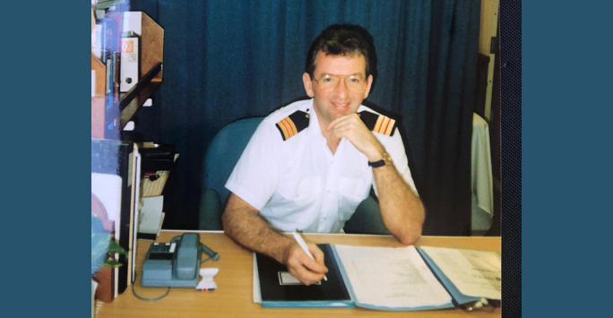 Dr Nigel Guest sits in the shipping office