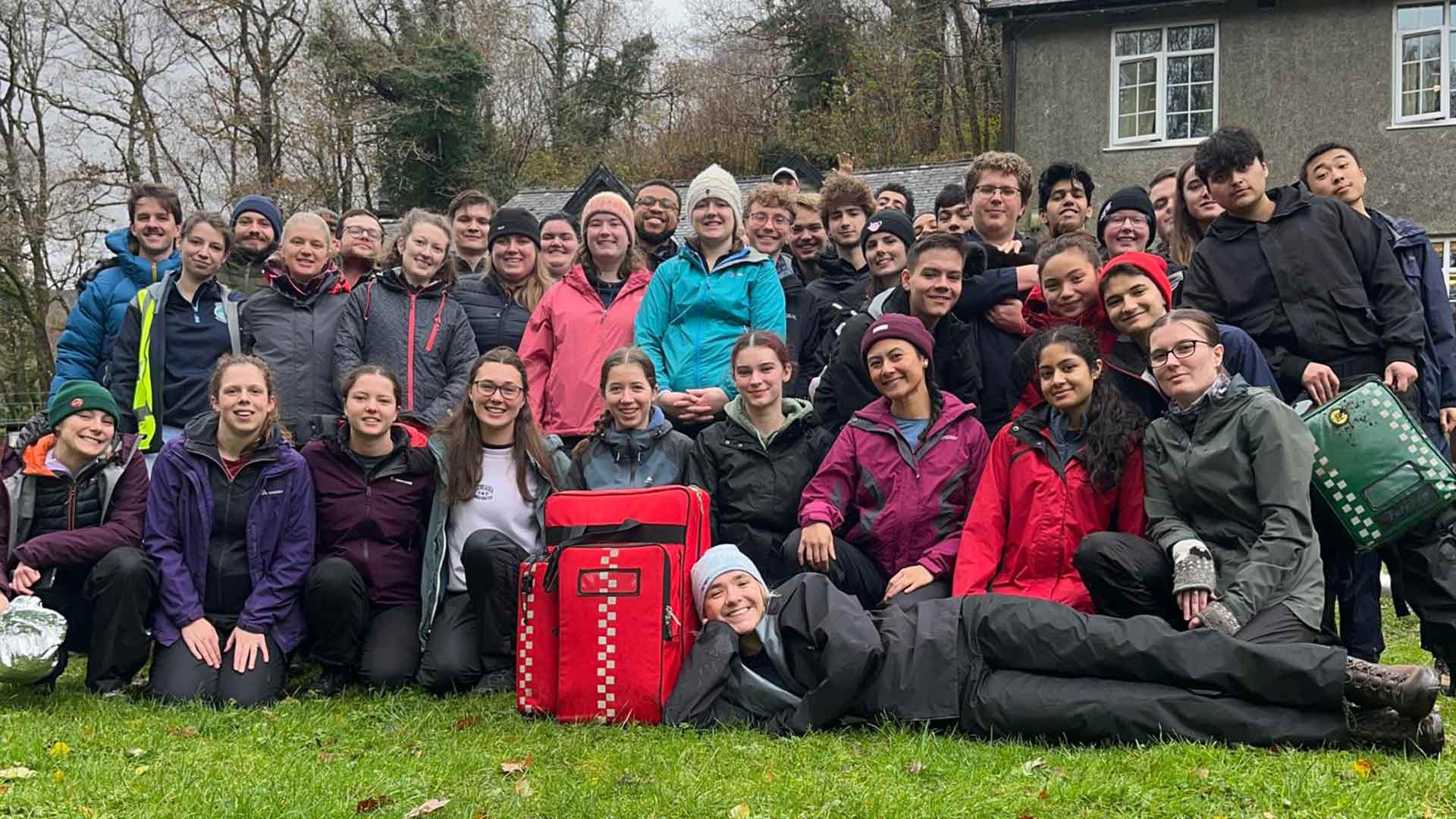 group of students in outdoor gear on an away weekend