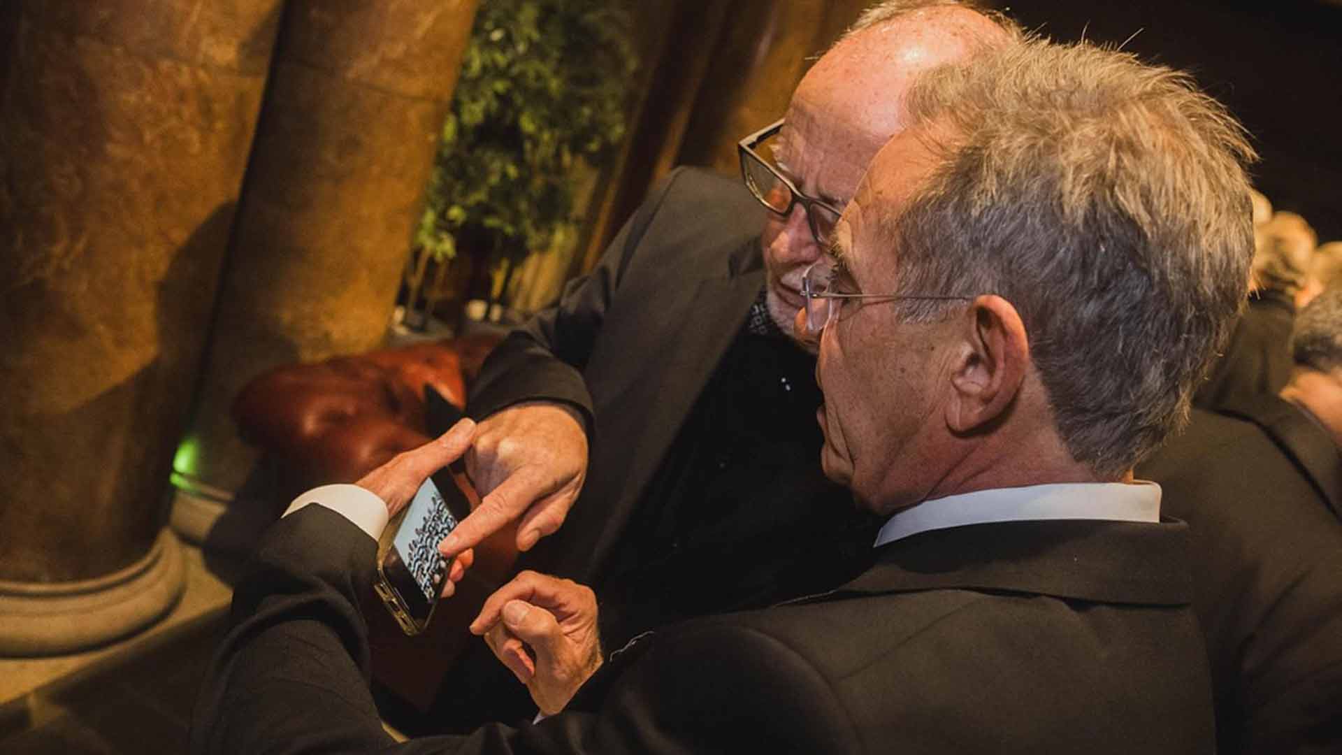 attendees look through old photos