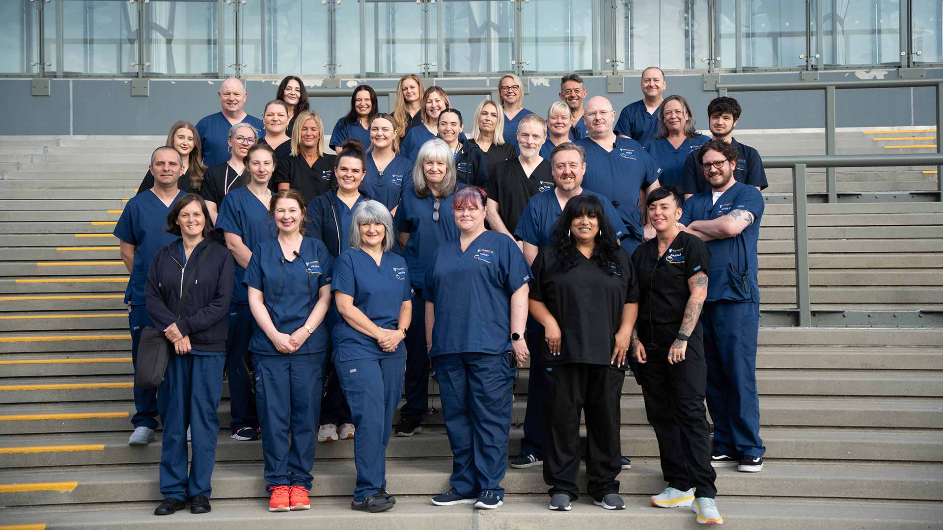 Liverpool School of Medicine Clinical Skills team pose for a team photo at Aintree Racecourse