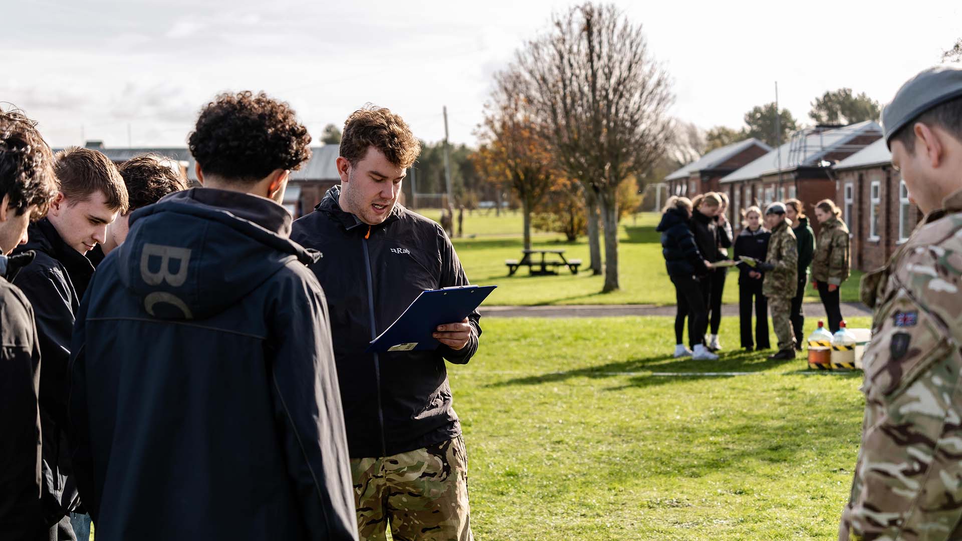 A student leads his group through an activity