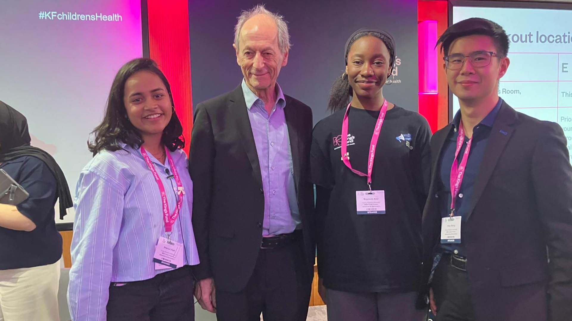 Yosola with researcher Sir Michael Marmot and others