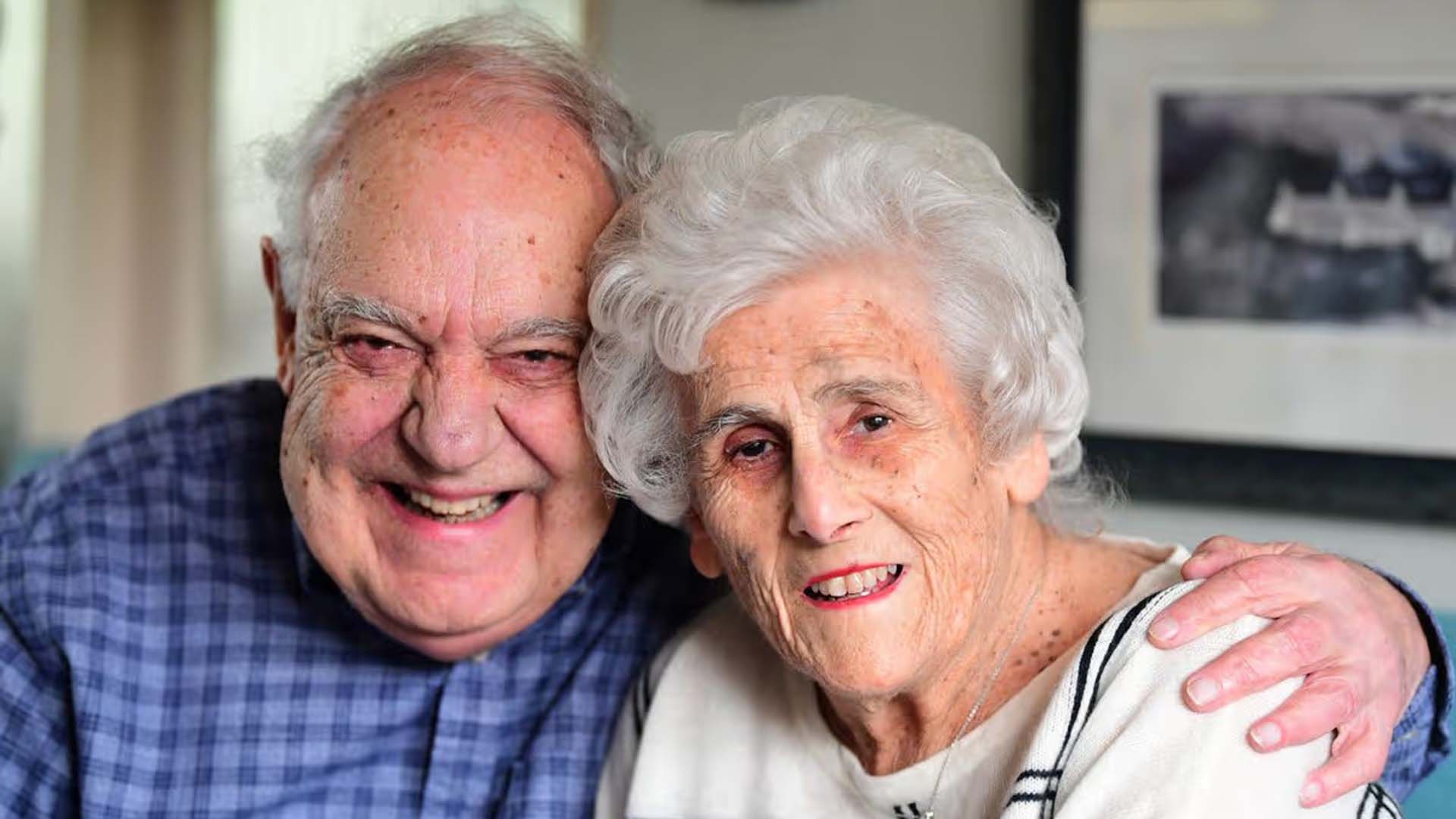 man and woman smiling