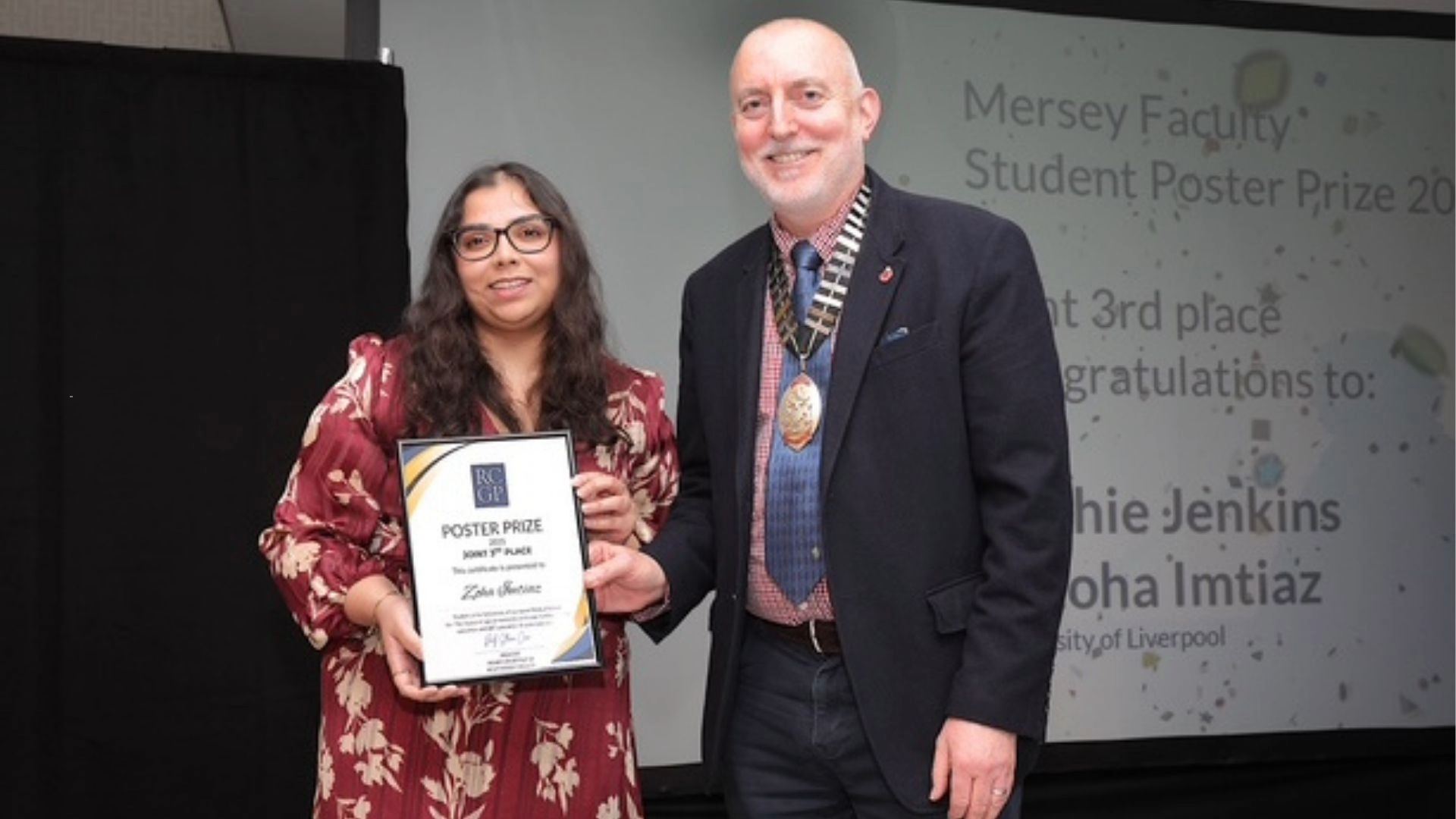 Student receives the Joint 3rd Place RCGP Mersey Faculty Poster Prize certificate from an RCGP representative