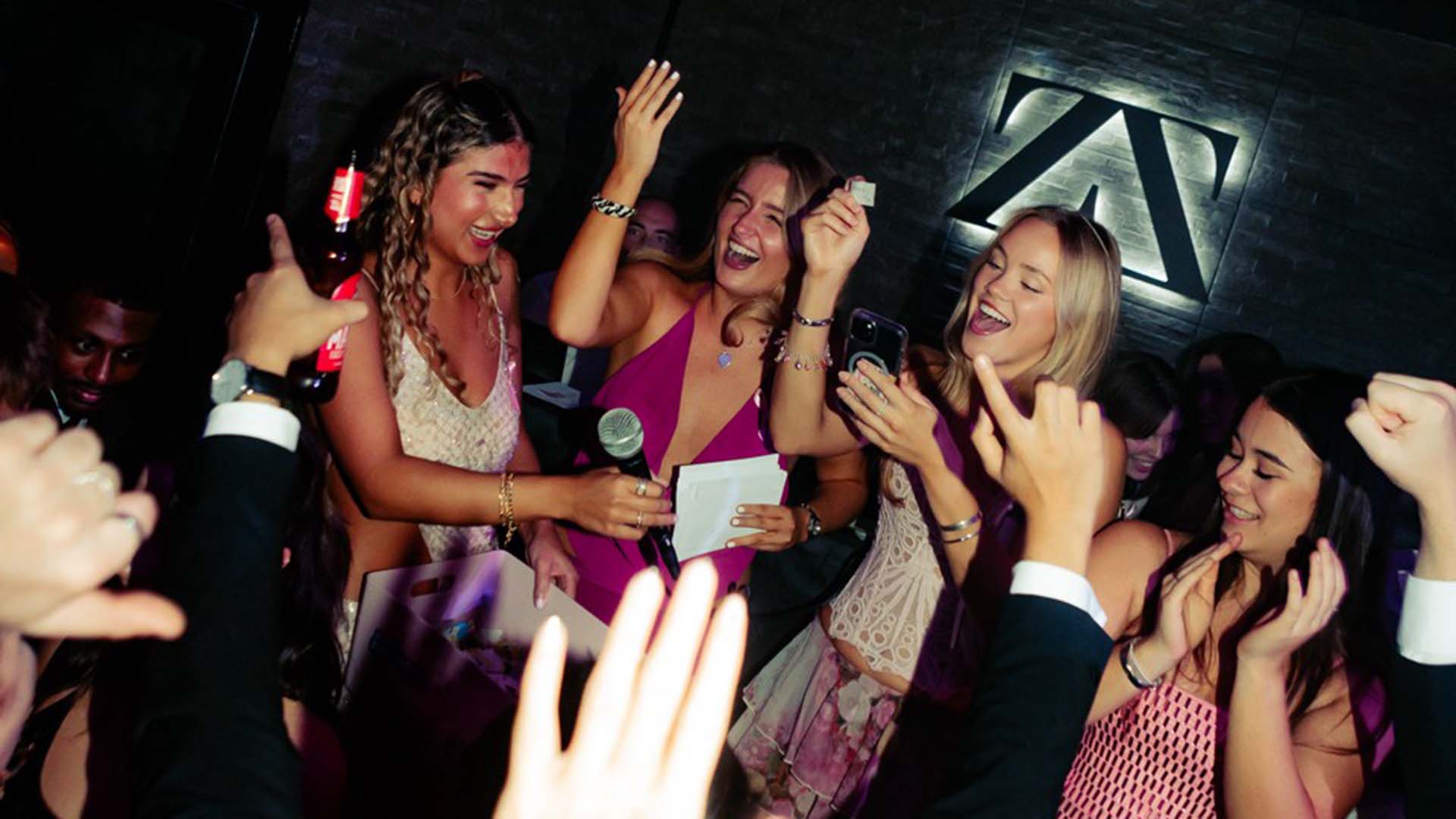 Students participate in a charity raffle at the Booby Ball