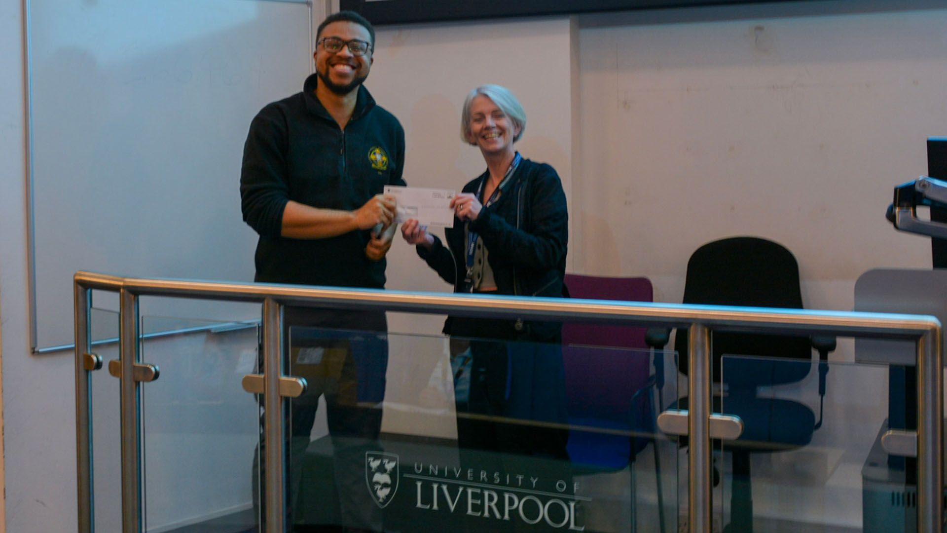 Student Doctor Chinonso is awarded for his presentation by Professor Kenny