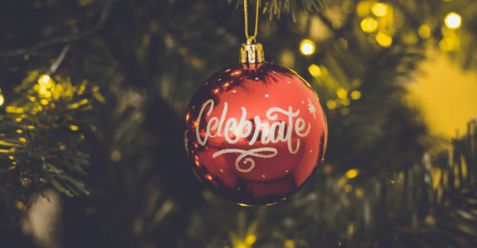 Celebrate bauble on a Christmas tree