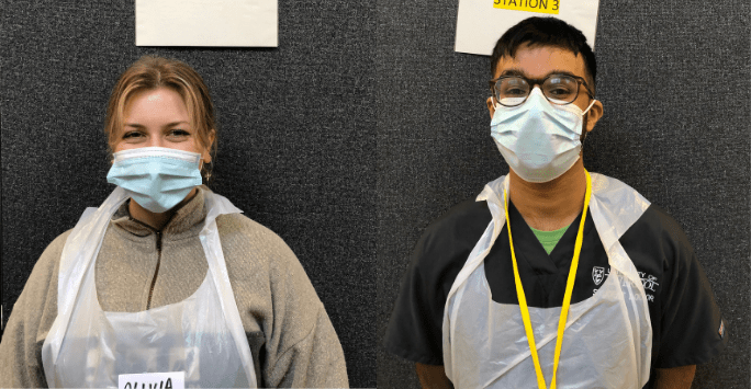 Students in PPE smiling at camera