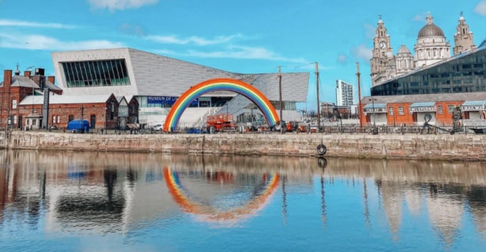 Liverpool waterfront with rainbow light installation