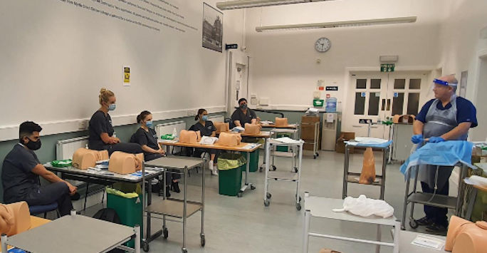 Students doctors taking part in a clinical skills session