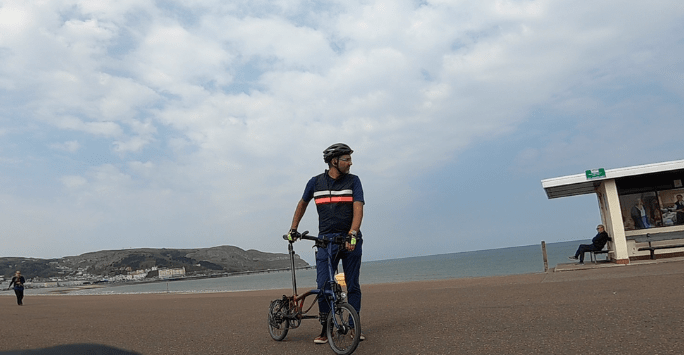 man on bike at the seaside