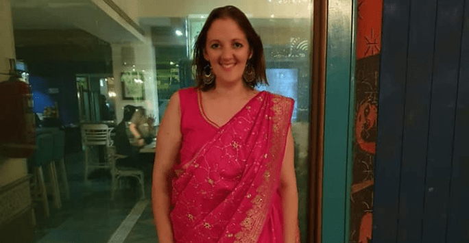woman dressed in pink sari