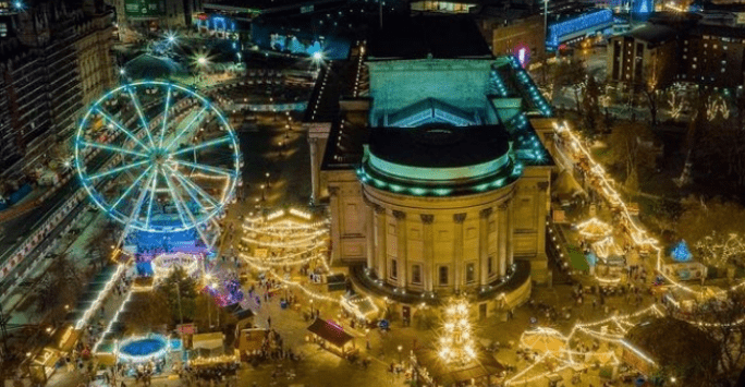 an aerial shot of St George's Hall with Christmas markets