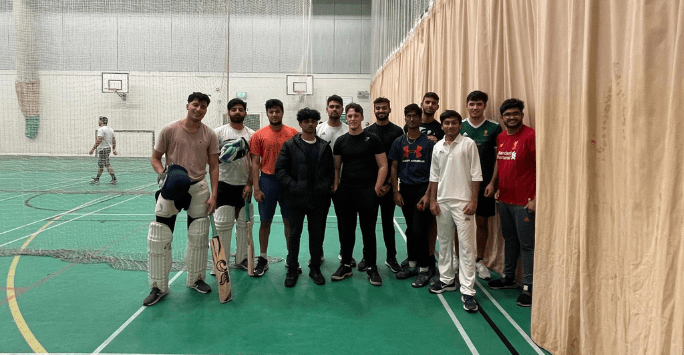 Group of cricketers in sport centre