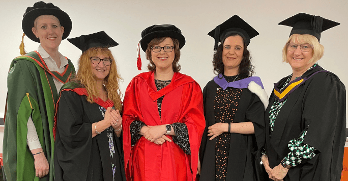 Academics in graduation gowns