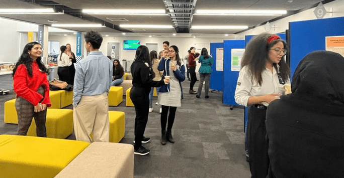 students present posters during conference