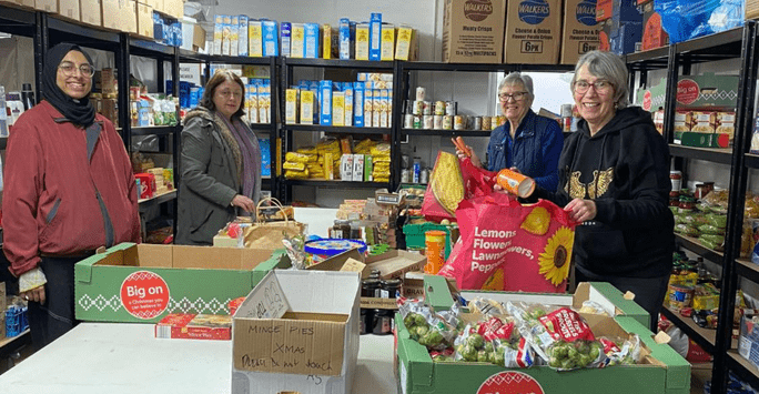 volunteers run a food bank for their local community