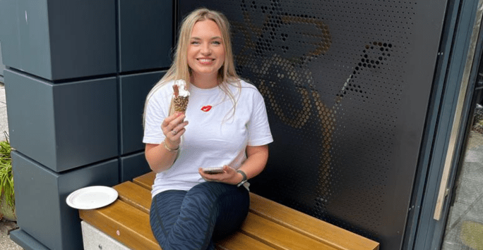 student enjoys an ice cream at wellbeing event