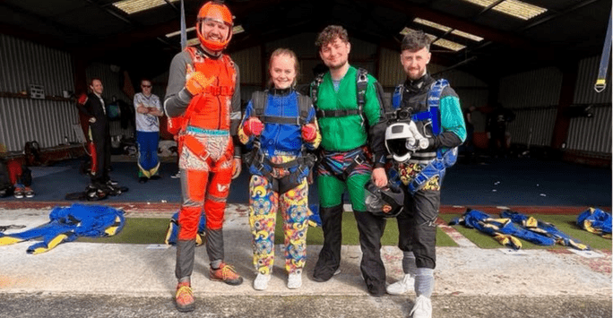 skydivers in colourful jumpsuits and Oddballs underwear