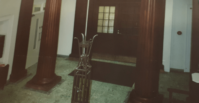 Entrance hall to building with dark wood