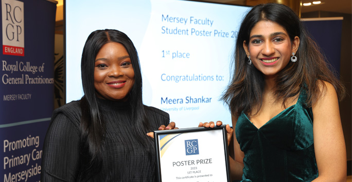 Student smiles with RCGP Prize certificate