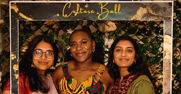 Three students smile for a photo at the Culture Ball