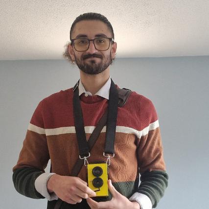 Jerry Kakkanattus holding yellow camera