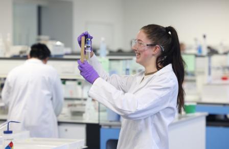 chem ug student in lab wearing lab coat