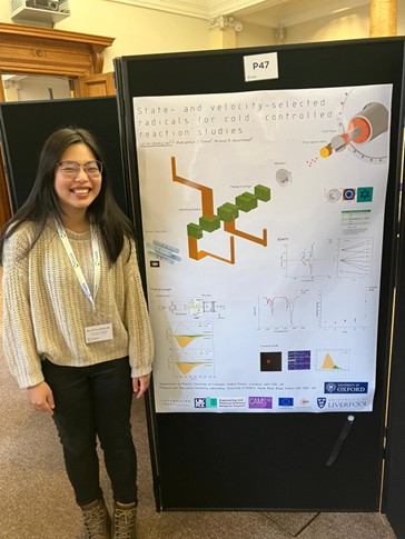 Dr Kathy Wu next to her research poster