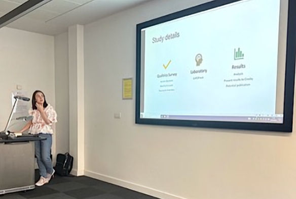 Lily Doran presenting her research on a screen at the Liverpool Autism Hub