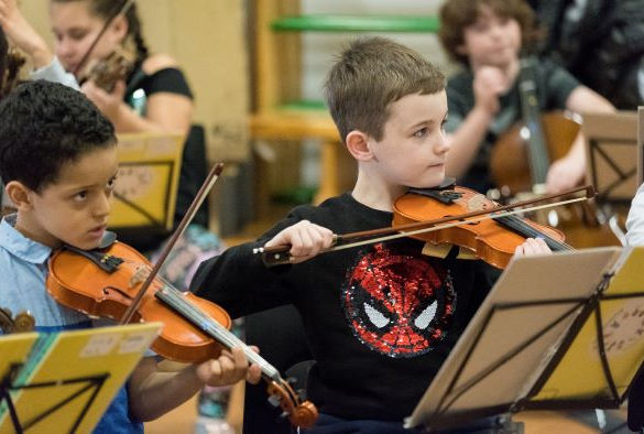 Two students playing violin