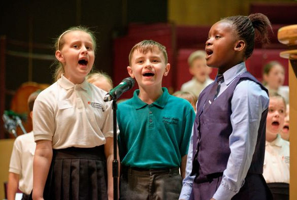 Three students singing