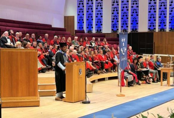 Jaden Moonsammy delivers a speech on behalf of Graduates