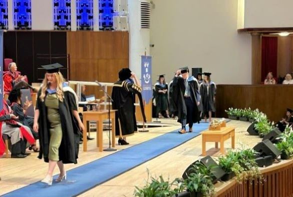 Graduates walked in a procession on the stage
