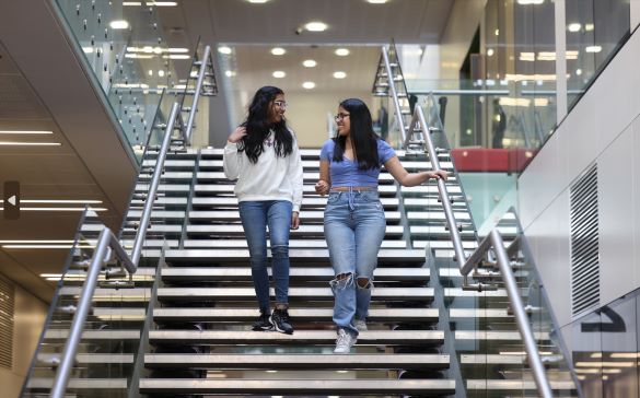 Students walking down stairs in the Central Teaching Hub on campus
