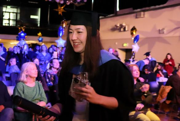 Student recieving a prize at Winter Graduation