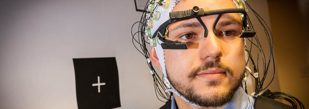Man wearing headset during an experiment at the School of Psychology