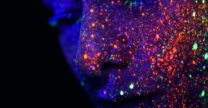 Graphic of face with multicoloured lights