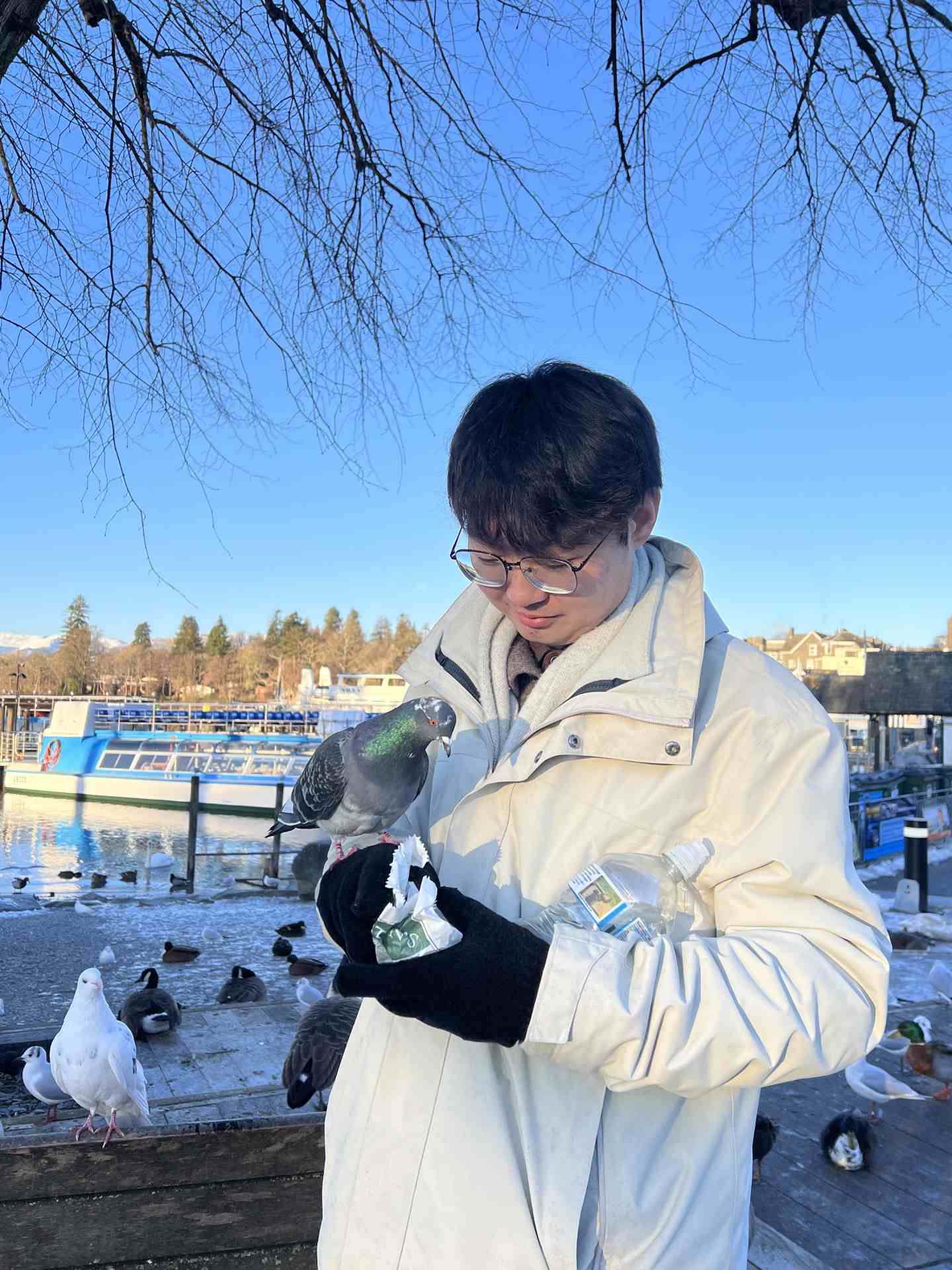 Weihao holding a pigeon