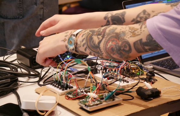 Photograph of a student with circuitry