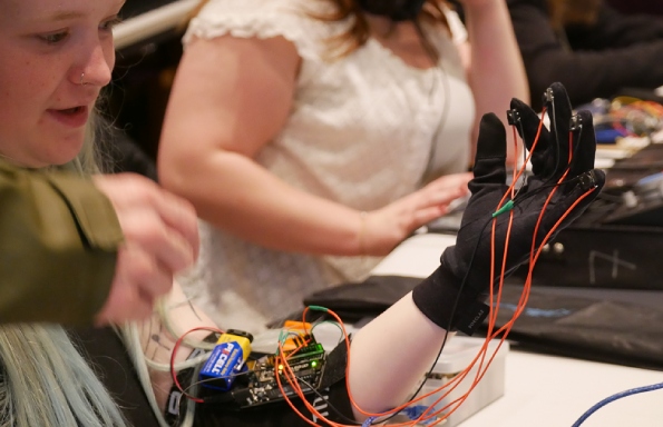 Photograph of student with a musical glove