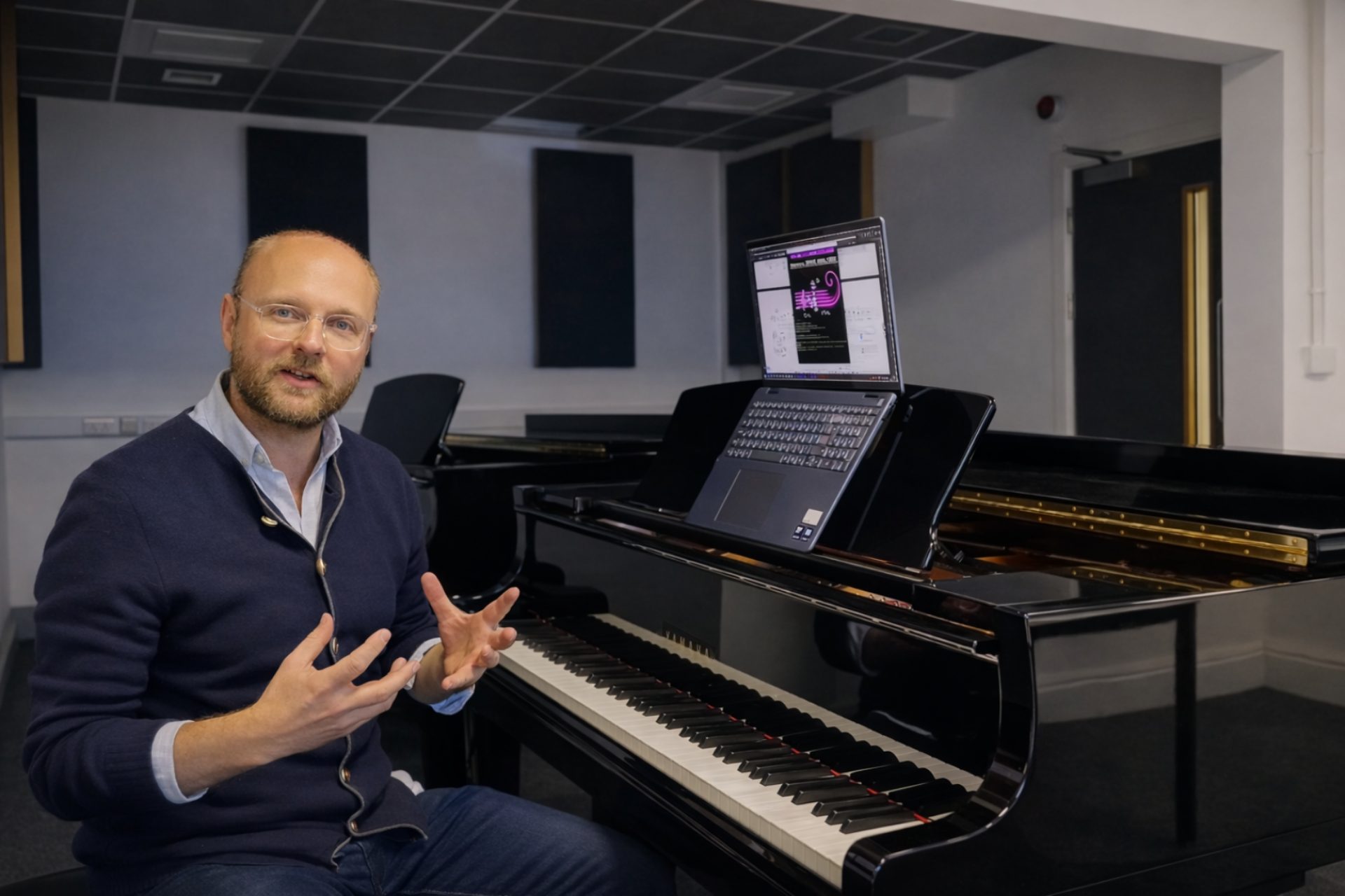 Professor Kenneth Smith at a piano
